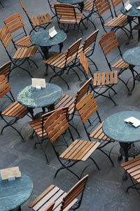 High angle view of empty chairs and table in building