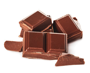 Close-up of chocolate cake against white background