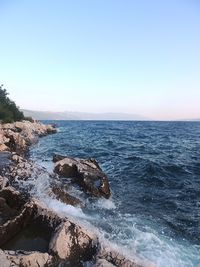 Scenic view of sea against clear sky