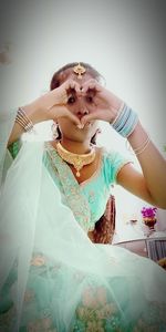 Woman standing against the wall