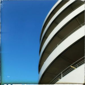 Low angle view of building against clear blue sky