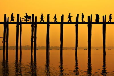 View of wooden post in water