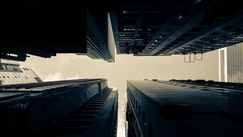 Directly below shot of buildings against sky