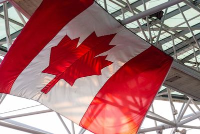 Low angle view of canadian flag against ceiling