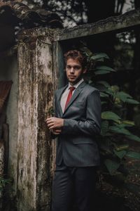 Portrait of young man standing outdoors