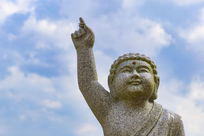 Low angle view of statue against sky