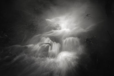 Low angle view of waterfall at night