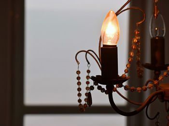 Close-up of illuminated light bulb