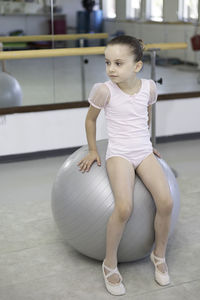 Young woman exercising in gym