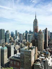 Modern buildings in city against sky