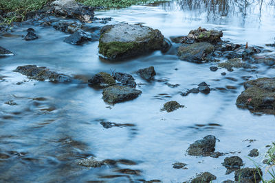 River flowing through rocks in forest