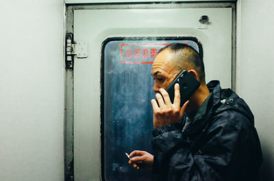 Portrait of man using mobile phone