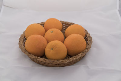 High angle view of fruits in basket on table