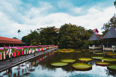 Scenic view of lake by building against sky