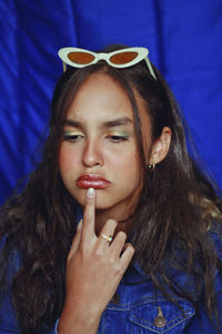 Close-up of thoughtful teenage girl with make-up looking away