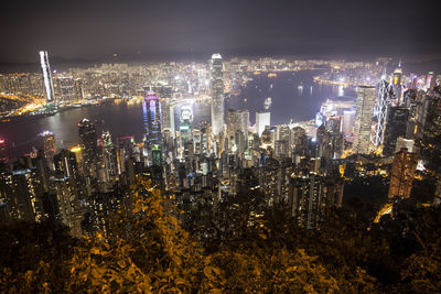 High angle view of city lit up at night