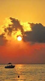 Scenic view of sea against orange sky