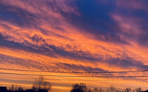 Low angle view of cloudy sky during sunset