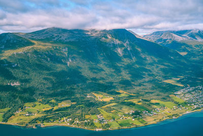 Aerial view of mountain range against sky