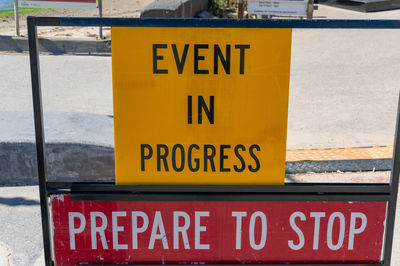 Close-up of warning sign on road