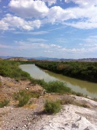 Scenic view of river against sky