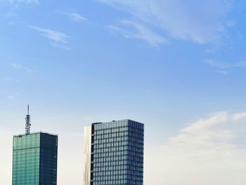 Low angle view of modern buildings against sky