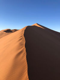 Scenic view of desert against clear sky