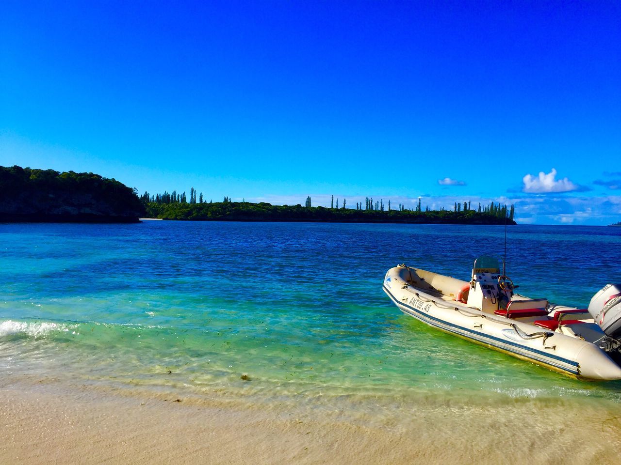 SCENIC VIEW OF CALM SEA AGAINST BLUE SKY