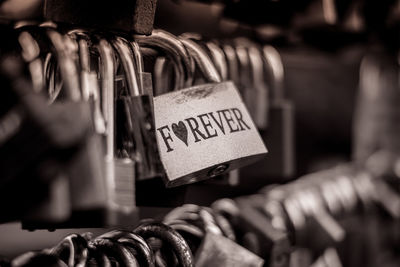 Close-up of love padlocks hanging on metal