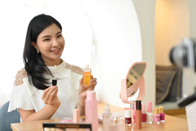 Portrait of smiling female dentist in laboratory