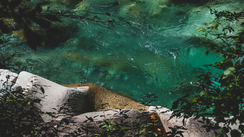 High angle view of rocks by sea