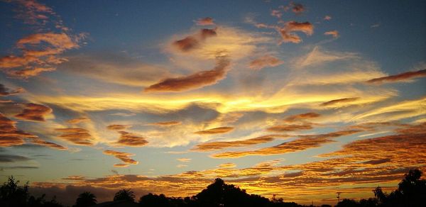 Scenic view of dramatic sky at sunset