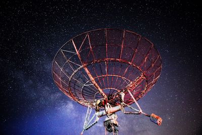 Low angle view of satellite against sky at night