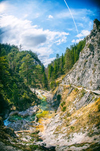 Scenic view of tree mountains against sky