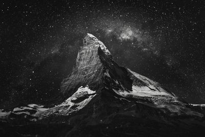 Low angle view of snow against sky at night