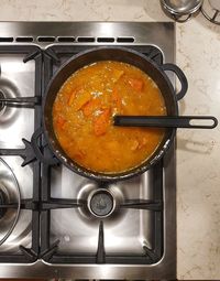 Directly above shot of cooking pan on barbecue grill