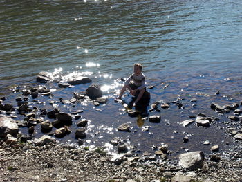 Woman standing on shore