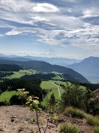 Scenic view of landscape and mountains against sky