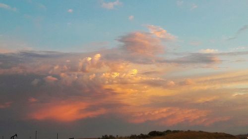 Low angle view of dramatic sky during sunset