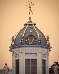 View of temple building against sky during sunset