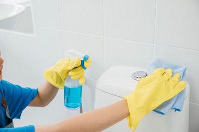 Midsection of man washing hands in bathroom