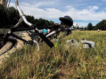 Bicycle on field against sky