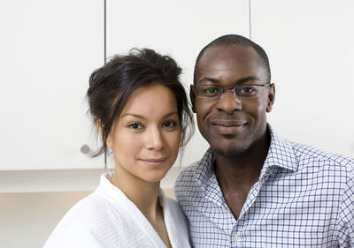 Portrait of smiling couple looking at camera