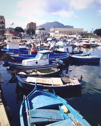 Boats moored at harbor