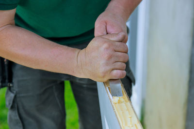 Close-up of man holding hands