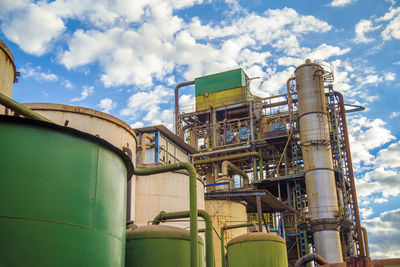 Low angle view of factory against sky