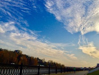 Scenic view of trees against blue sky