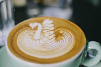 Close-up of cappuccino on table