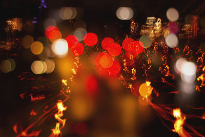 Close-up of illuminated christmas lights at night