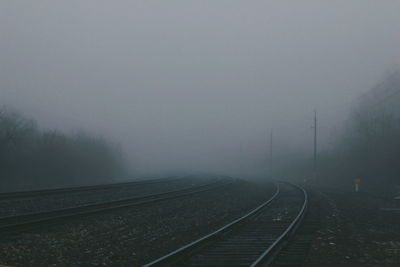 View of railway tracks in foggy weather